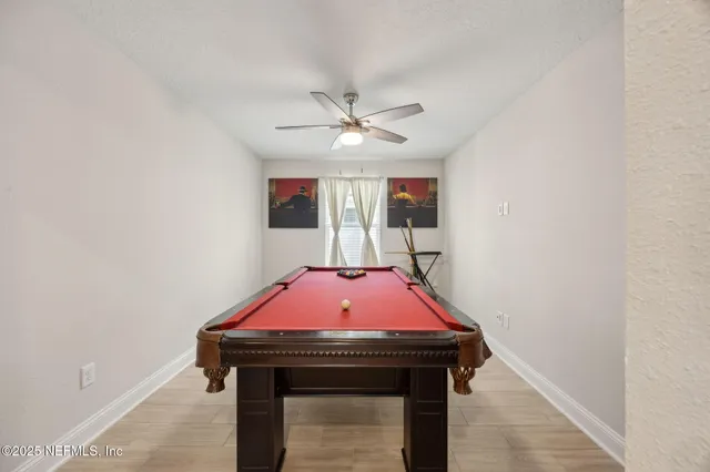 a living room with a chandelier and a rug