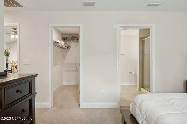 a bedroom with a bed and a sink