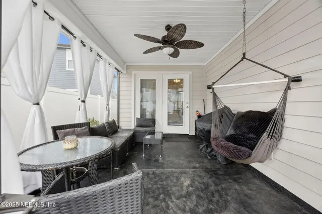a living room with furniture a window and a table