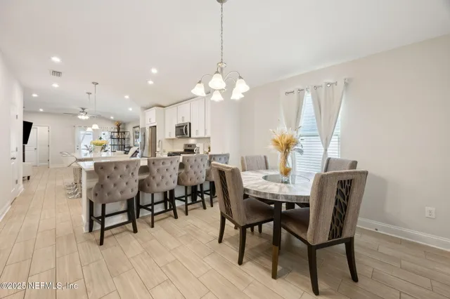 a dining room with furniture and window