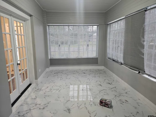 a view of an empty room with a window