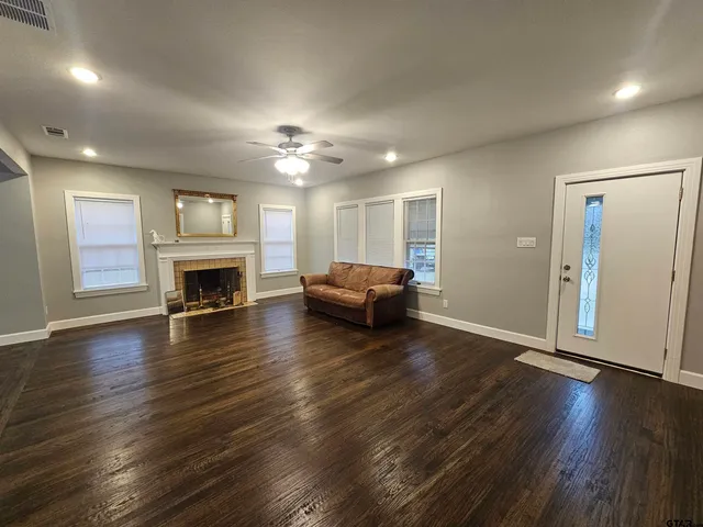 a living room with furniture and a fireplace