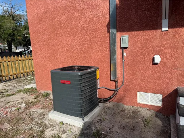 a view of a street with a small yard