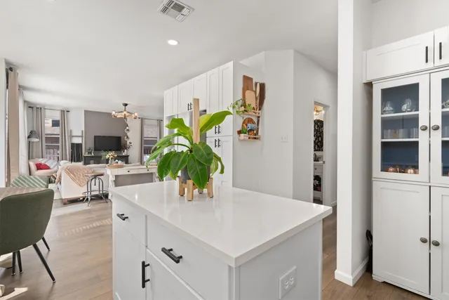 a kitchen with a table and chairs