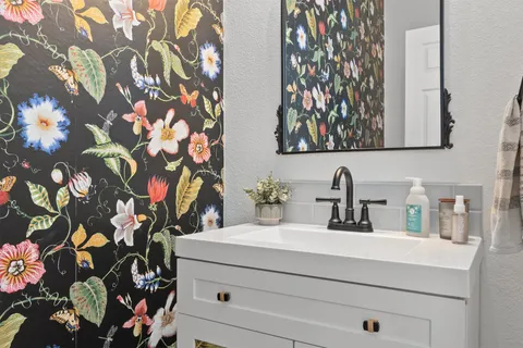 a bathroom with a sink and a mirror