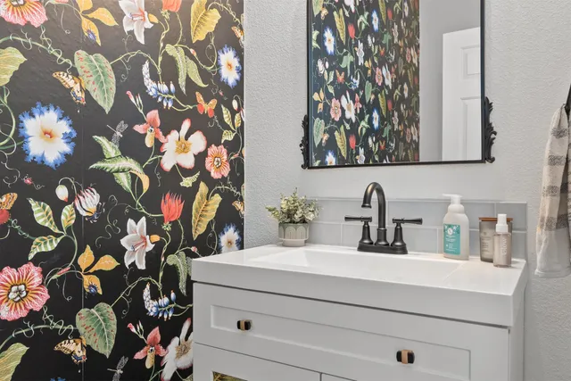 a bathroom with a sink and a mirror