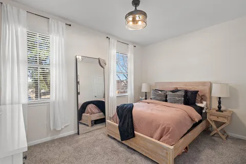 a front view of a house with a large window