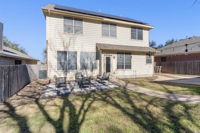 a front view of a house with a sitting area