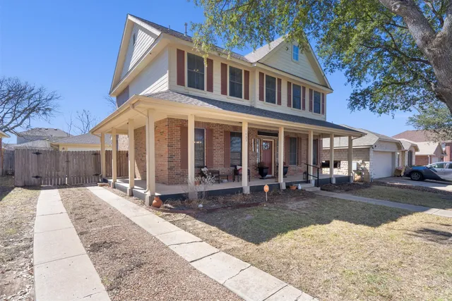 a front view of a house with a yard outdoor seating and barbeque oven