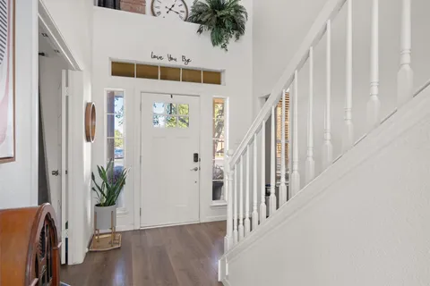 a view of entryway with wooden floor