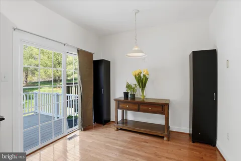 a view of a room that has a bed and a window