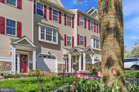a view of a brick building next to a yard