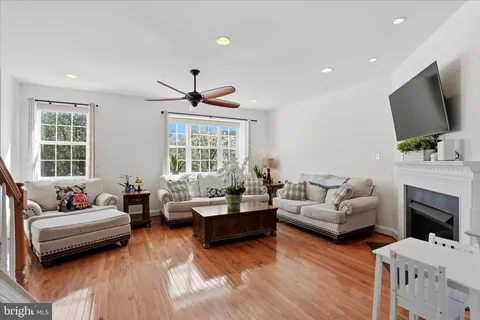 a living room with fireplace furniture and a flat screen tv