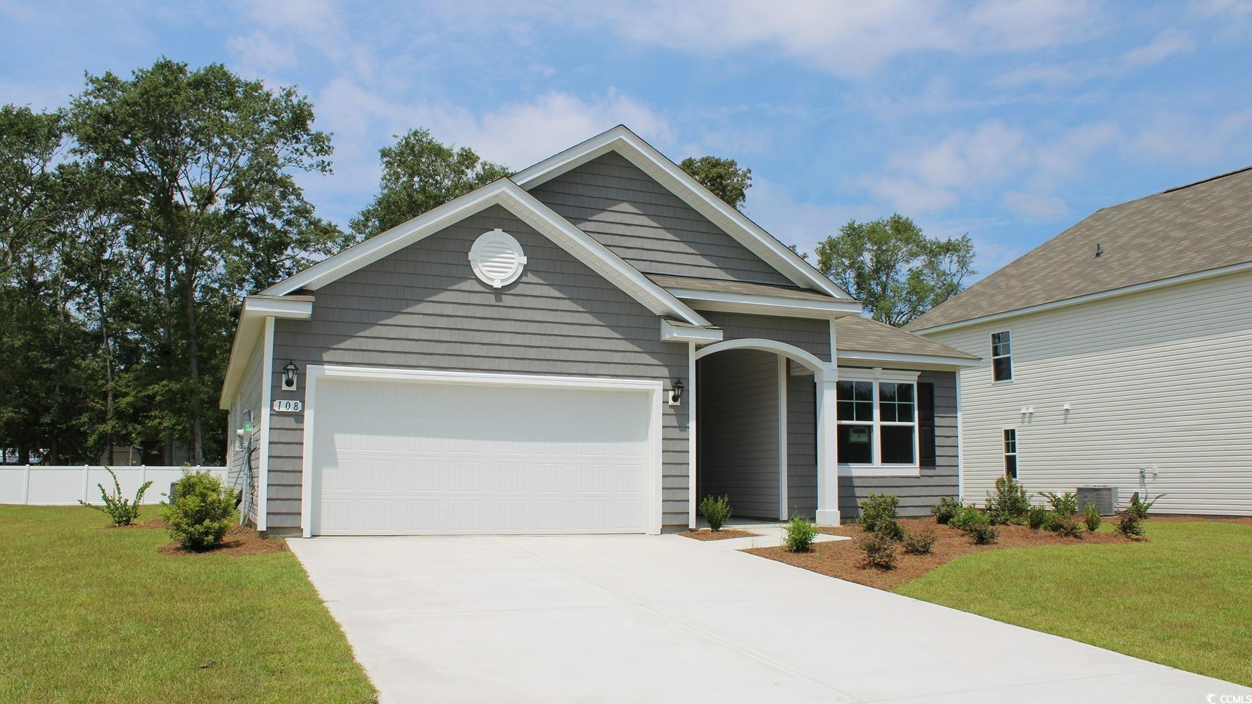 108 Fair Meadow Loris, SC 29569 - Photo 2 of 24 Craftsman-style house with a front lawn, cooling unit, and a garage