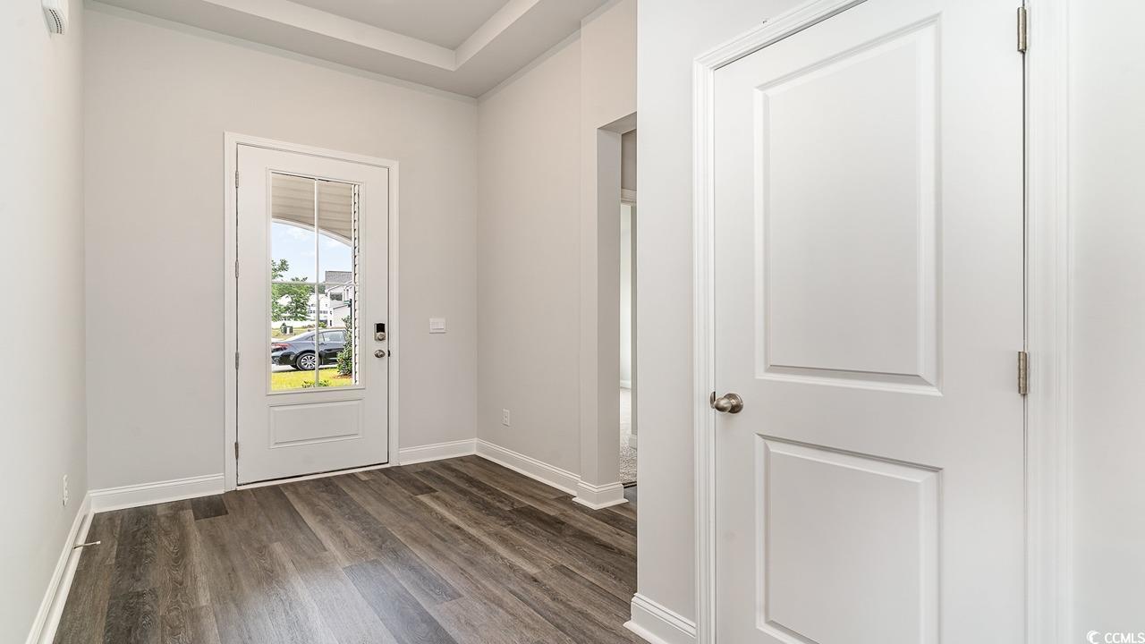 108 Fair Meadow Loris, SC 29569 - Photo 3 of 24 Doorway to outside featuring dark hardwood / wood-style floors