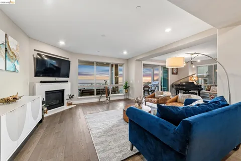 a living room with fireplace furniture and a flat screen tv
