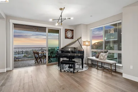 a outdoor dining space with furniture and city view