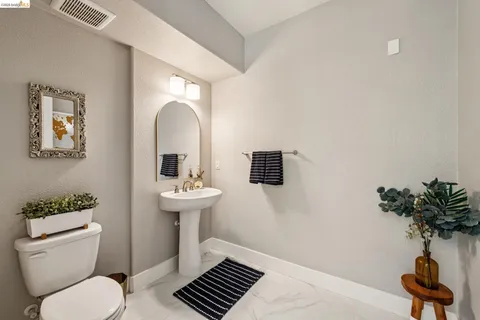 a bathroom with double vanity sinks a vanity and a mirror