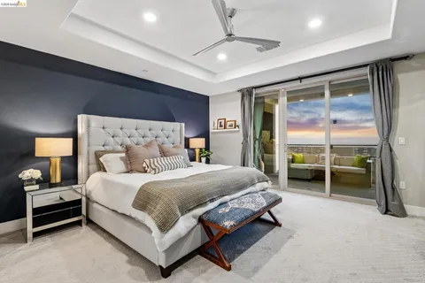 image of a living room with a floor to ceiling window and wooden floor