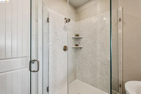 a bathroom with a bathtub and shower