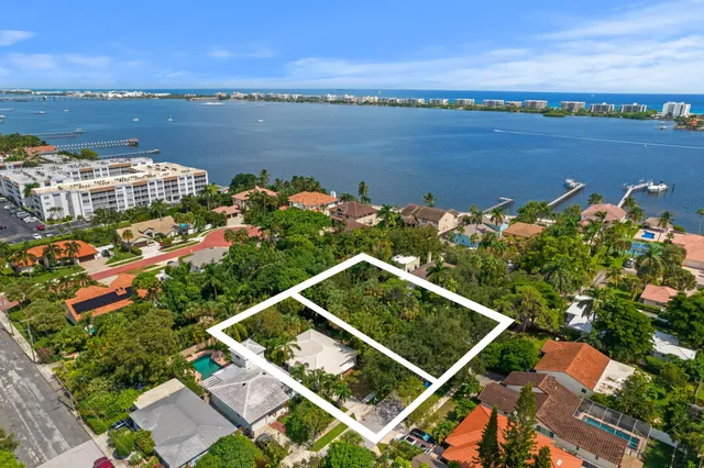 a view of a lake with a table and chairs