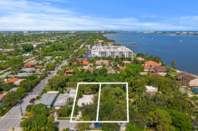 an aerial view of a house with swimming pool and garden