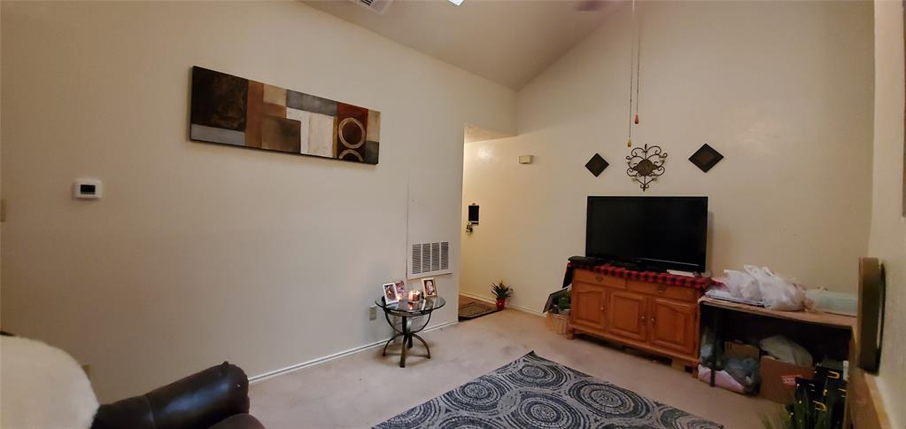 3012 North Bell Avenue Denton, TX 76209 - Photo 5 of 15 a view of workspace with a flat screen tv