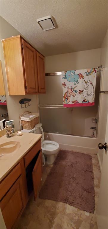 3012 North Bell Avenue Denton, TX 76209 - Photo 7 of 15 a bathroom with a sink a toilet and mirror