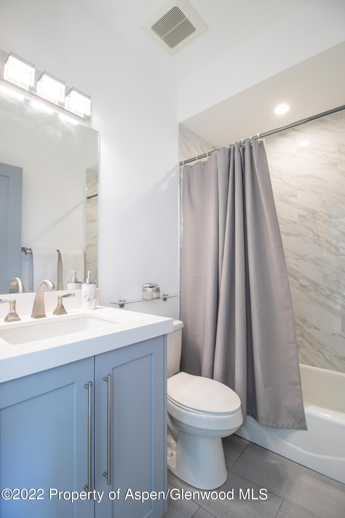 715 Eagles Nest Drive Silt, CO 81652 - Photo 12 of 19 a bathroom with a toilet a sink and a mirror