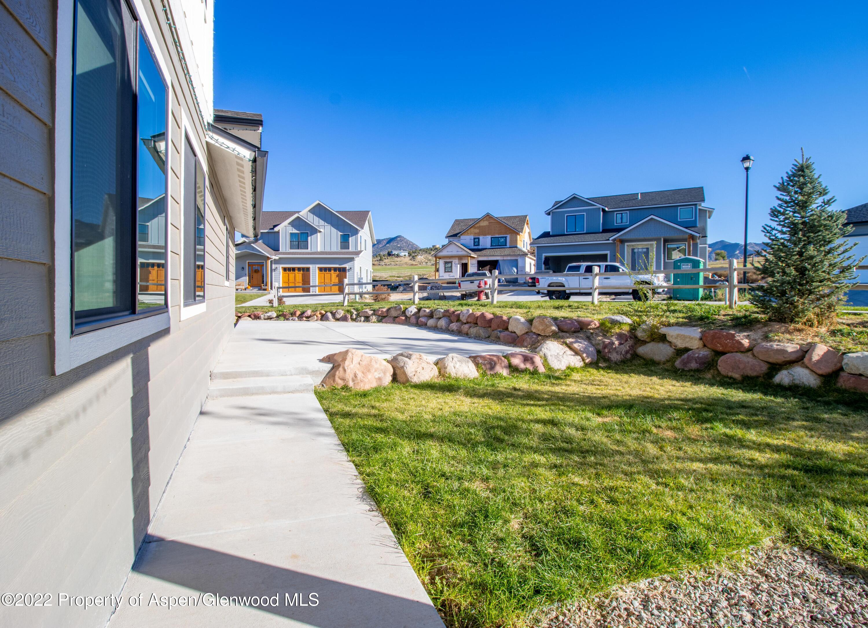 715 Eagles Nest Drive Silt, CO 81652 - Photo 14 of 19 a front view of a house with a garden