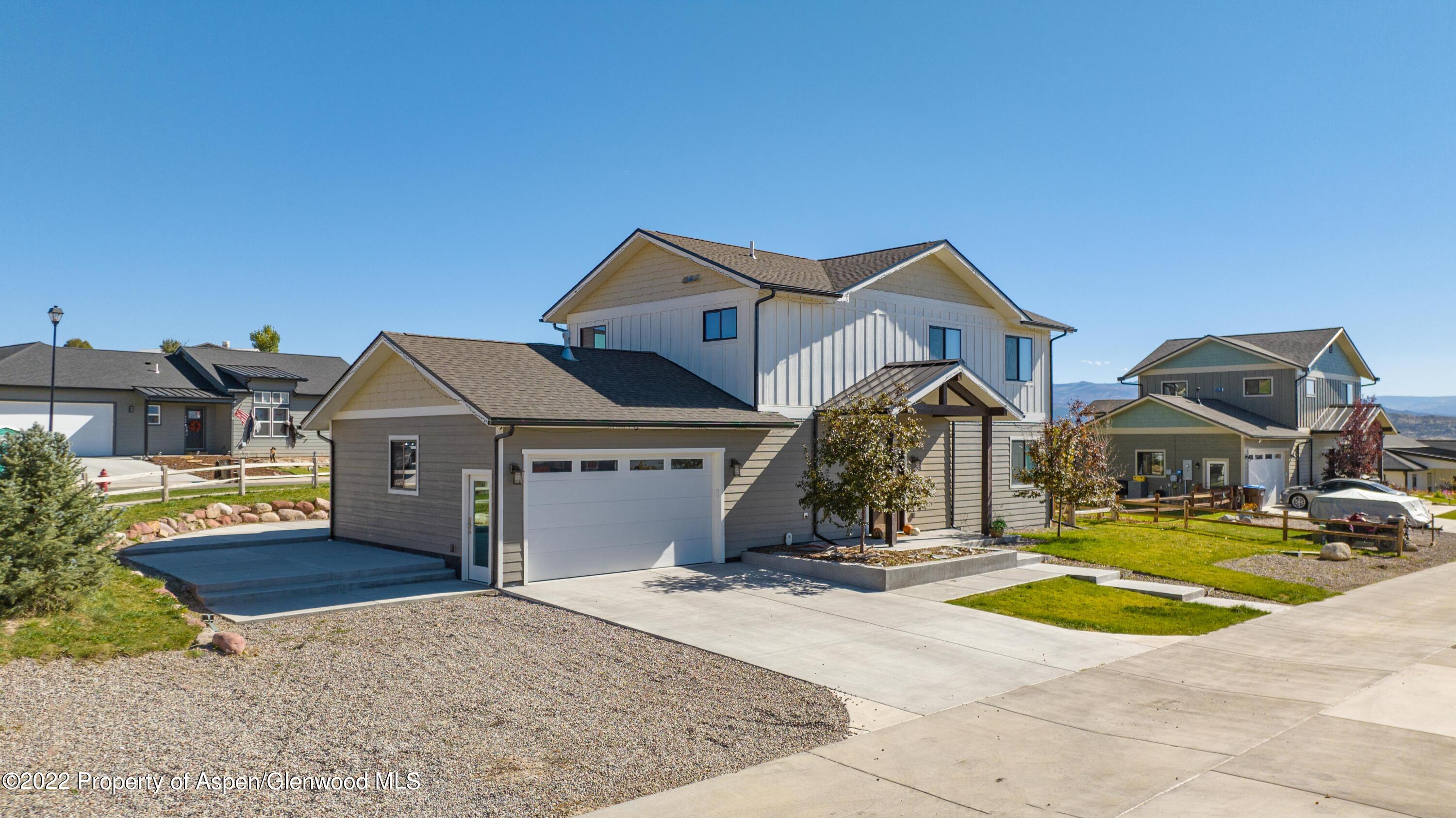 715 Eagles Nest Drive Silt, CO 81652 - Photo 2 of 19 a view of a big house with a big yard and large trees