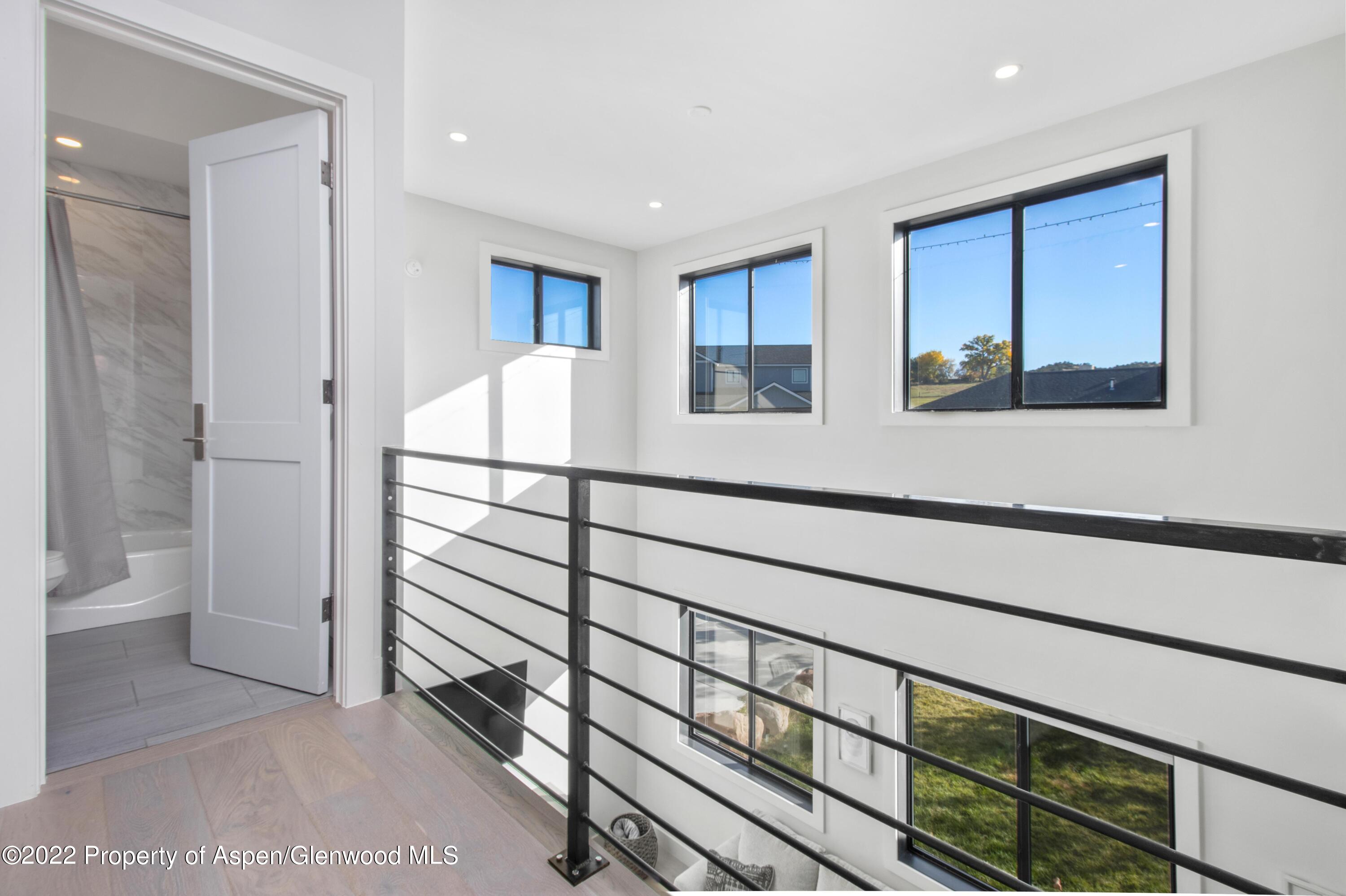 715 Eagles Nest Drive Silt, CO 81652 - Photo 8 of 19 a view of hallway with a large window