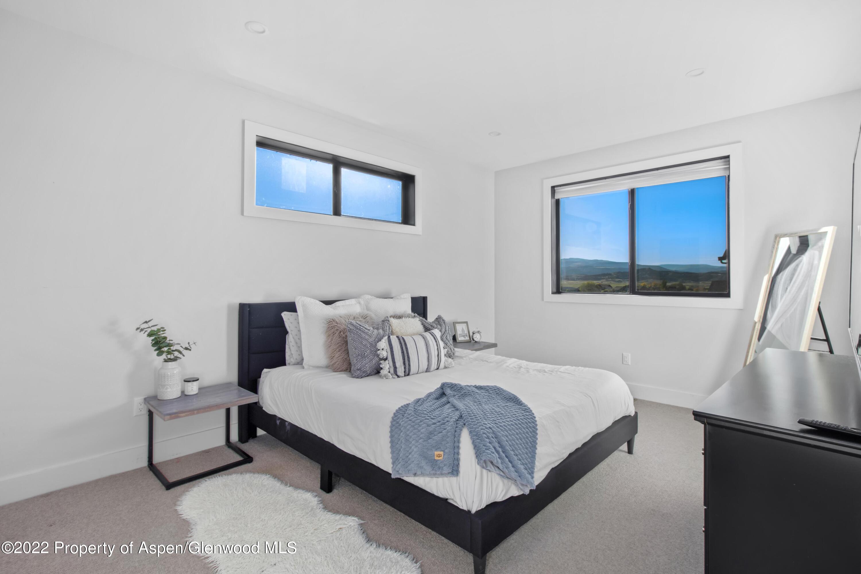 715 Eagles Nest Drive Silt, CO 81652 - Photo 9 of 19 a bedroom with a bed and a window