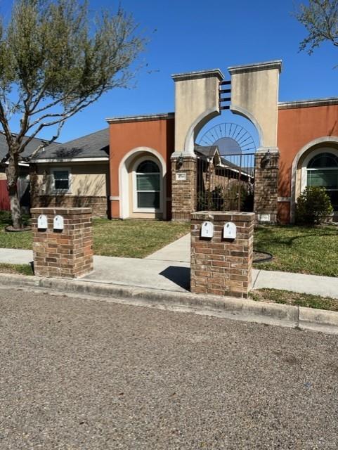 4708 North Cypress Street Pharr, TX 78577 - Photo 4 of 10 View of front of home with stucco siding and fence