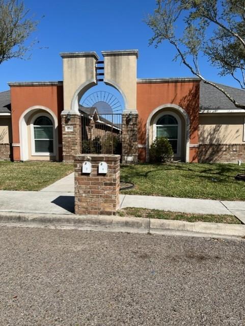 4708 North Cypress Street Pharr, TX 78577 - Photo 5 of 10 View of front of property with a front lawn and stucco siding
