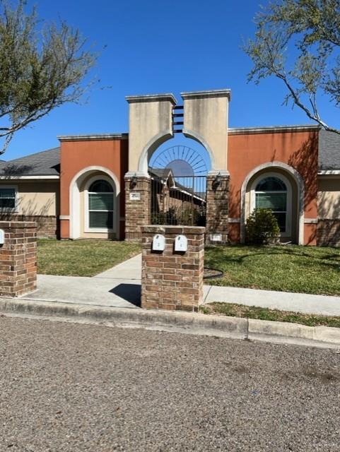 4708 North Cypress Street Pharr, TX 78577 - Photo 6 of 10 View of front of home with a front yard and stucco siding