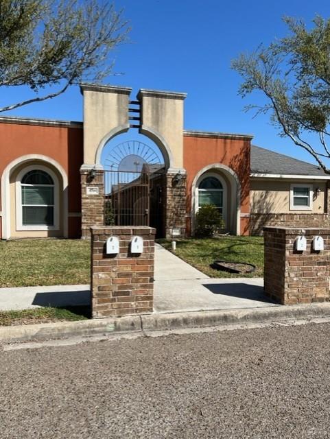 4708 North Cypress Street Pharr, TX 78577 - Photo 7 of 10 View of front facade with a front lawn and stucco siding