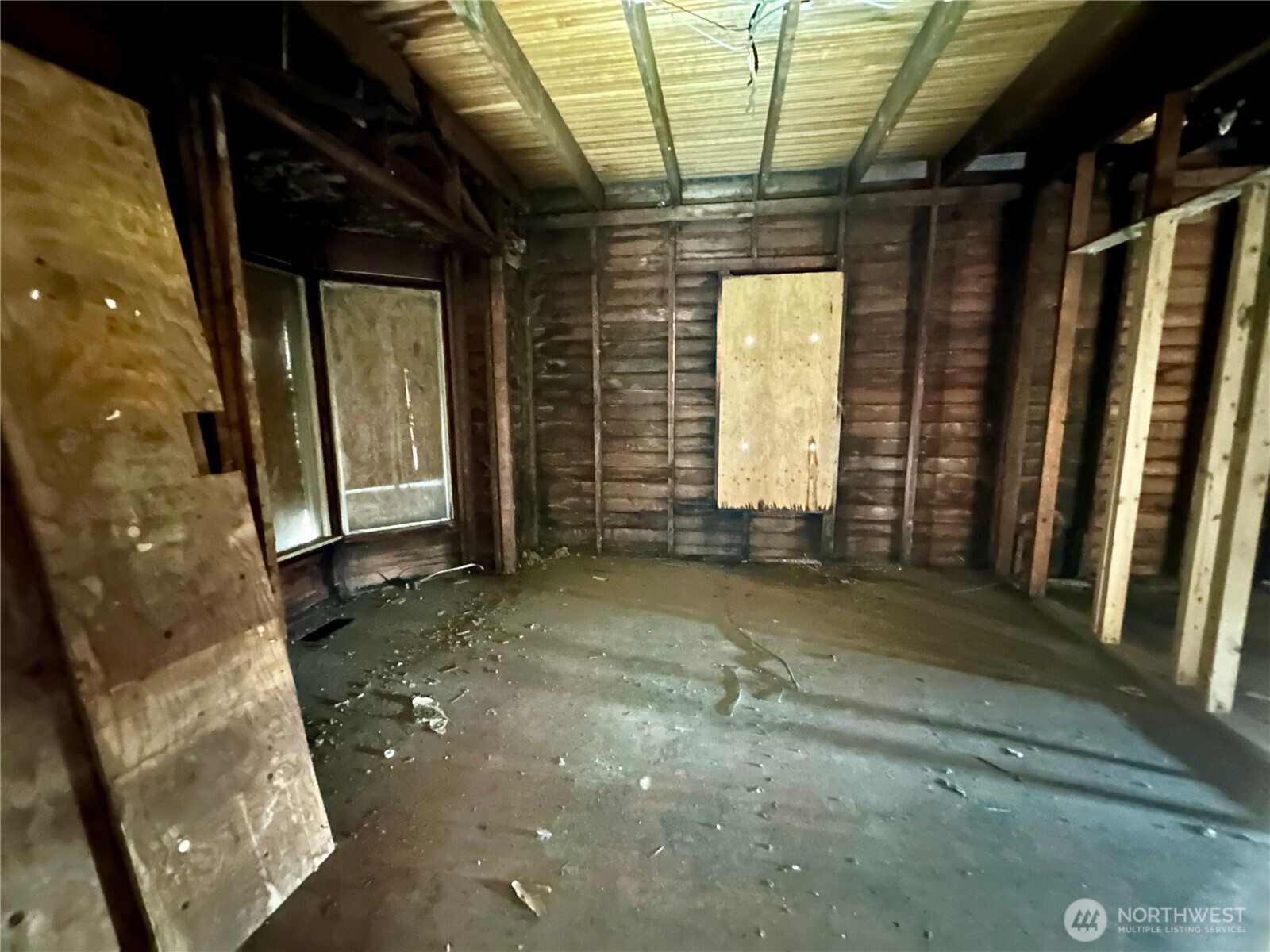 2620 Rucker Avenue Everett, WA 98201 - Photo 8 of 11 a view of a room with wooden walls and stairs