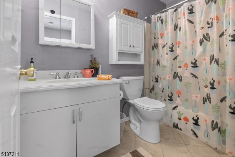3701 Park Place Springfield, NJ 07081 - Photo 22 of 38 a bathroom with a sink toilet and shower