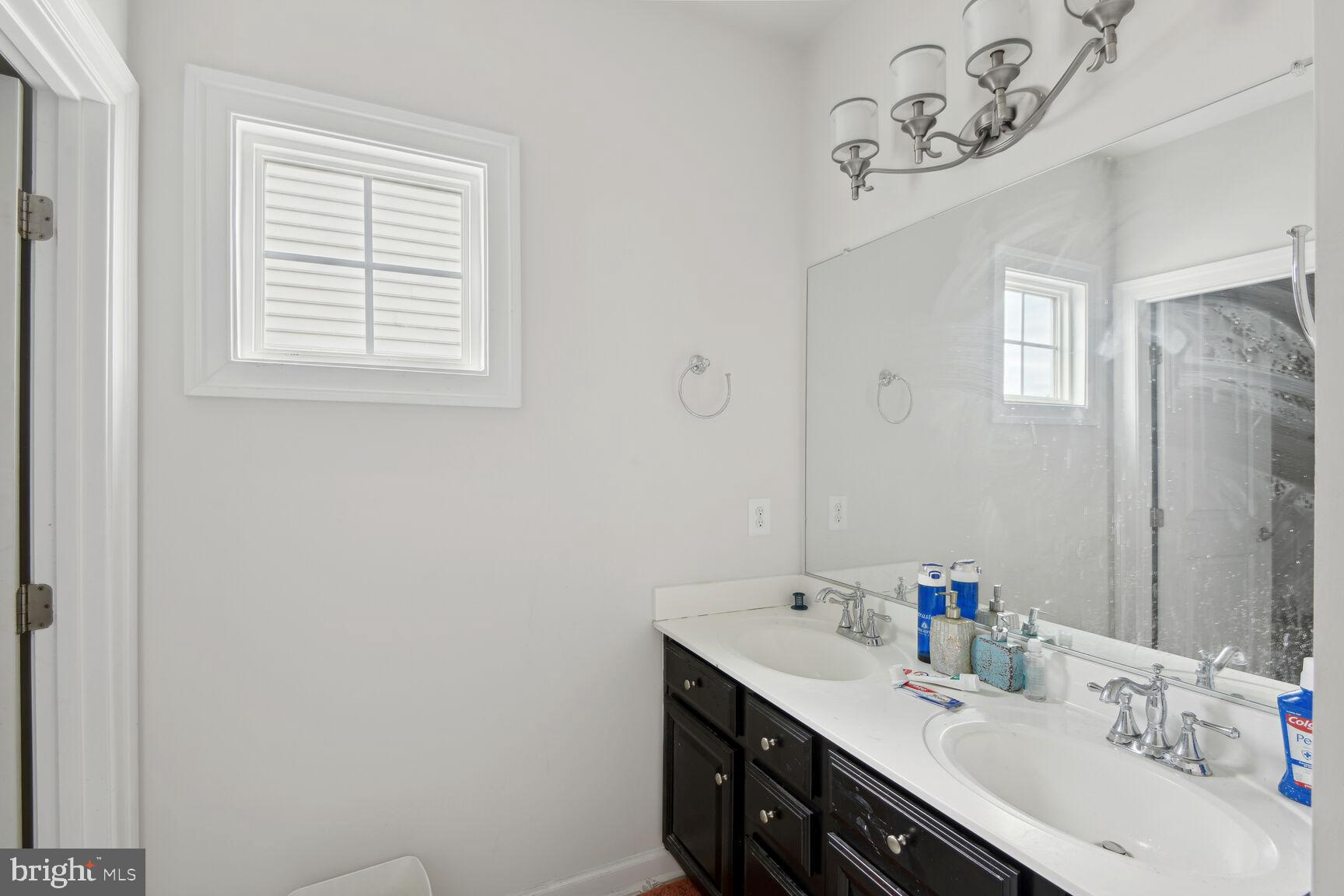 14607 Parkgate Drive Laurel, MD 20707 - Photo 20 of 25 Bathroom Sink and Mirror.