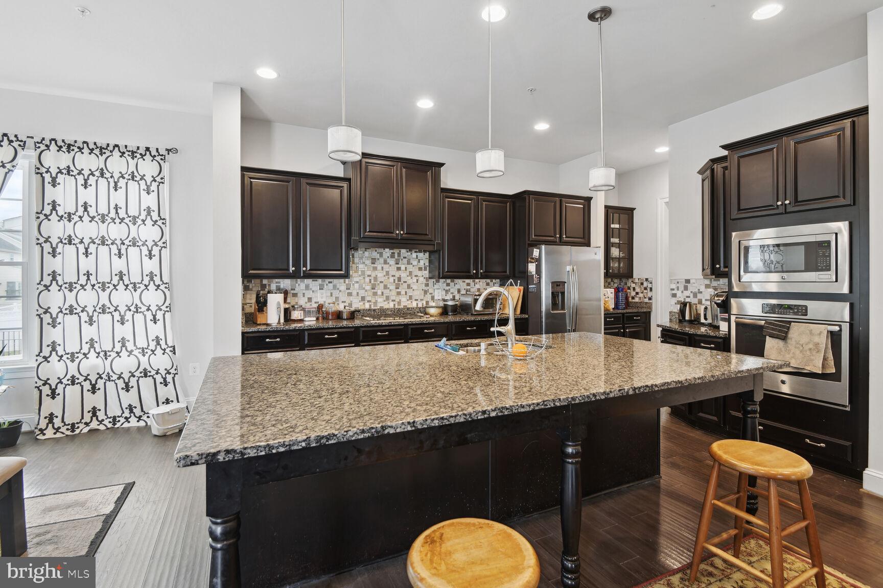 14607 Parkgate Drive Laurel, MD 20707 - Photo 10 of 25 Granite countertop, Built-in microwave and oven.
