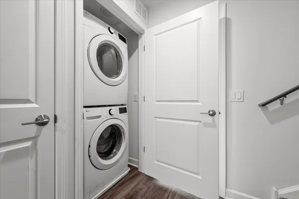 a utility room with sink dryer and washer