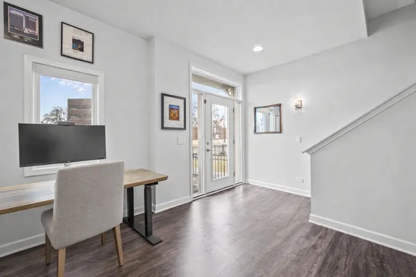 a view of a livingroom with furniture and wooden floor