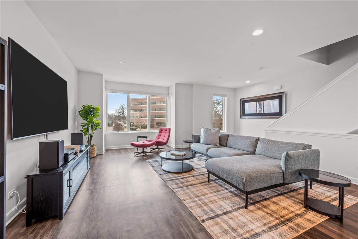 1229 Shermer Road Northbrook, IL 60062 - Photo 4 of 21 a living room with furniture and a flat screen tv