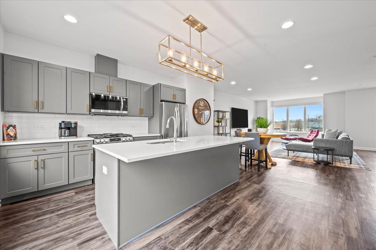 1229 Shermer Road Northbrook, IL 60062 - Photo 5 of 21 a kitchen with counter top space a sink cabinets and appliances
