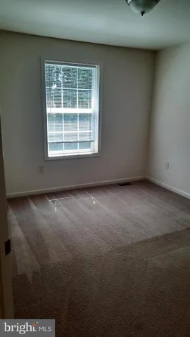 a bathroom with a toilet a sink and shower