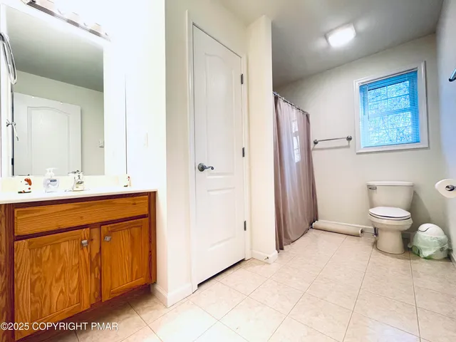 a view of a backyard with table and chairs
