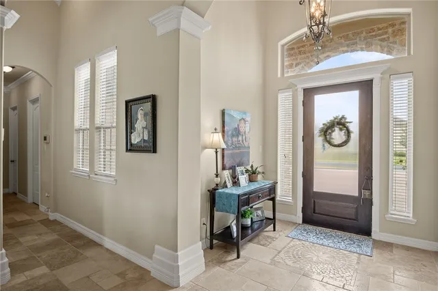 a room that has a dresser and a mirror in it