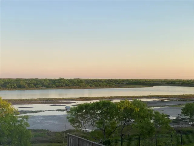 a view of lake with green space