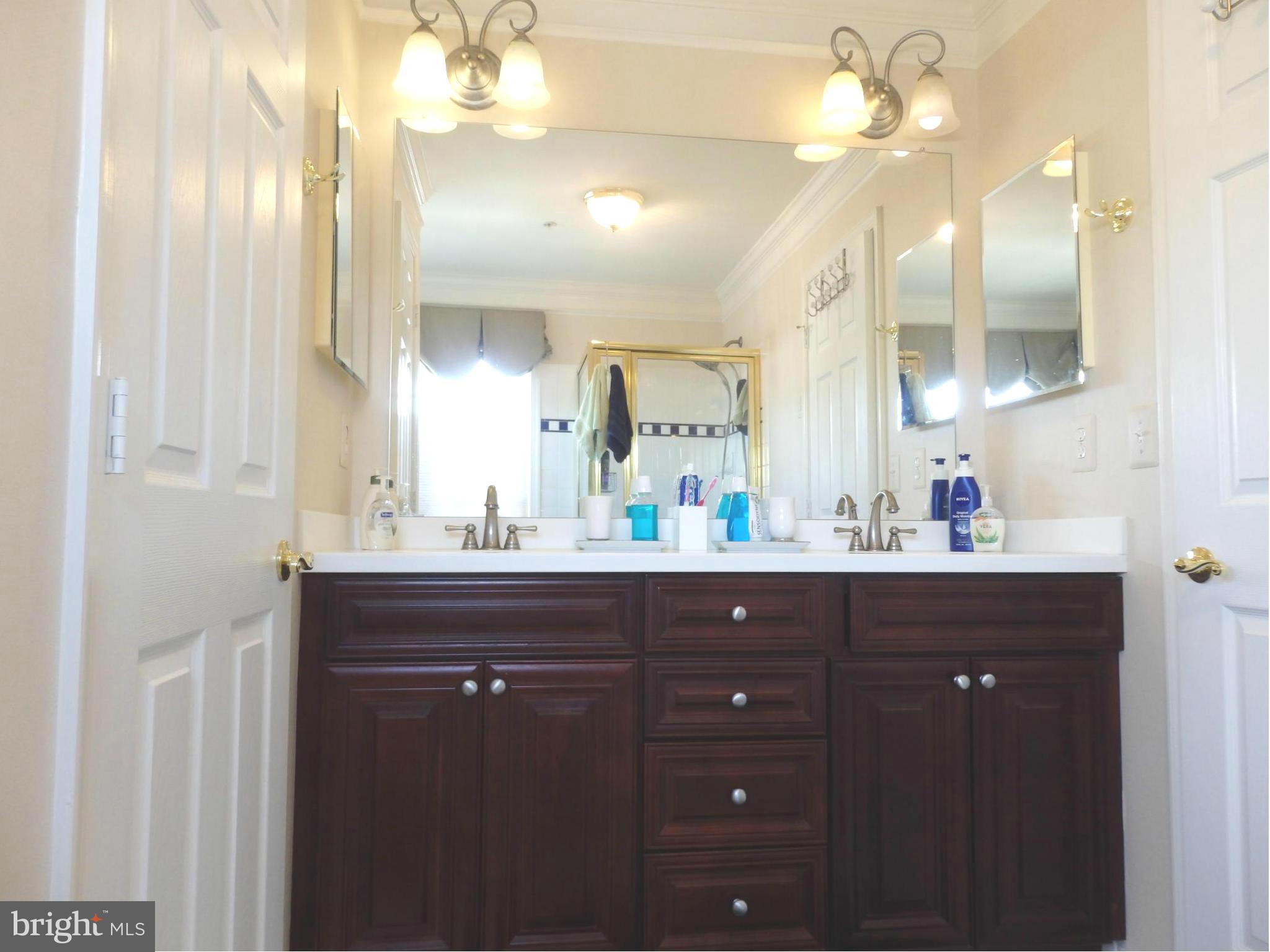 2634 Mill Race Road Frederick, MD 21701 - Photo 17 of 30 Cherry cabinets and double sinks in owners' bath